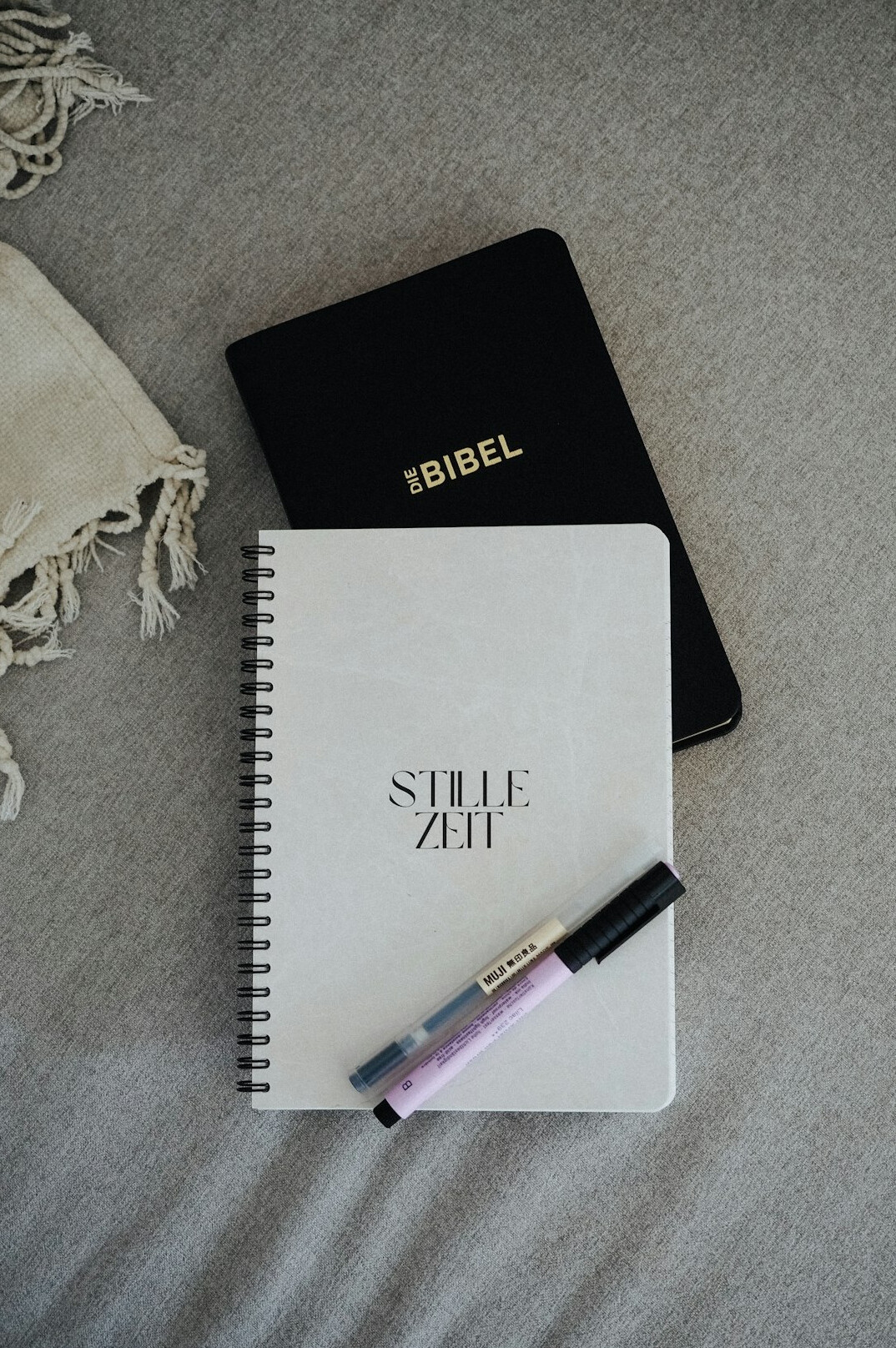 Script and notes on a notebook next to a pen